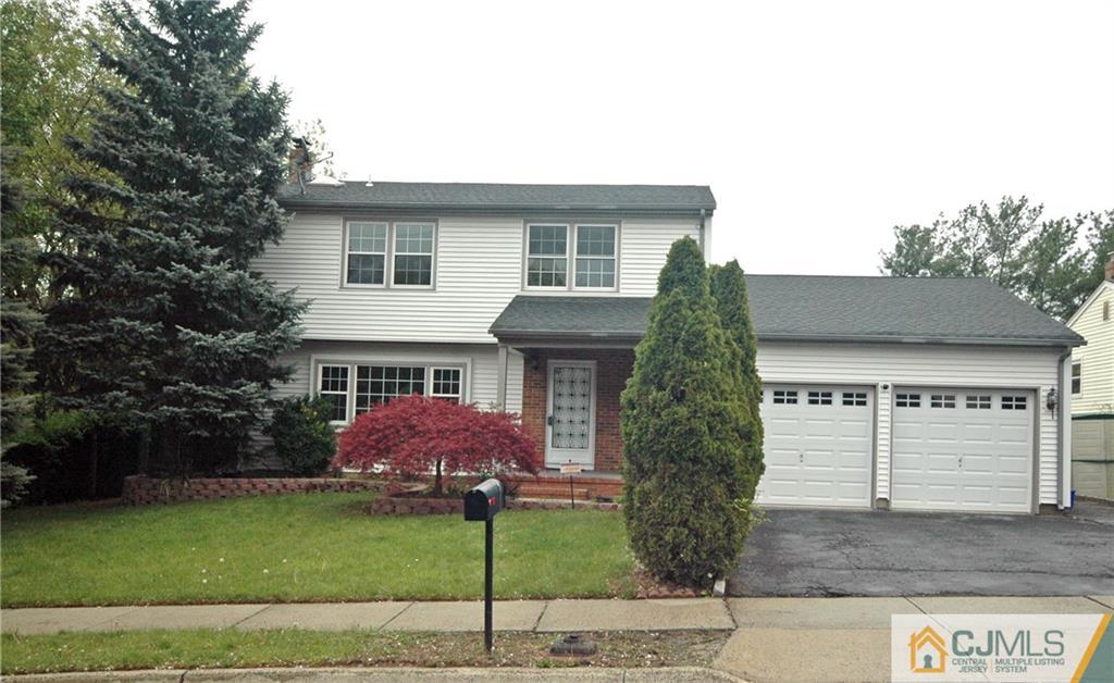 43 Brookside Road Edison, NJ 08817 - Photo 1 of 21 a front view of a house with garden