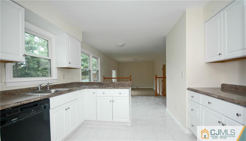 43 Brookside Road Edison, NJ 08817 - Photo 6 of 21 a kitchen with granite countertop white cabinets and a sink
