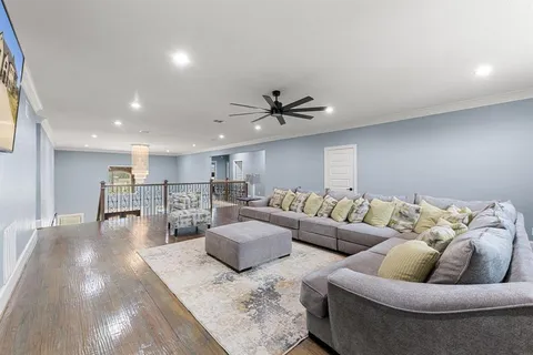a bedroom with a bed window and a couch