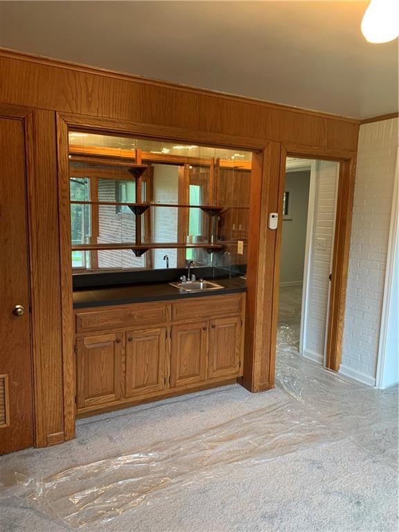 630 Broughton Road Bethel Park, PA 15102 - Photo 17 of 25 a spacious bathroom with a granite countertop sink and a mirror