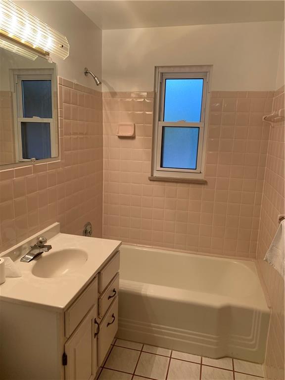 630 Broughton Road Bethel Park, PA 15102 - Photo 18 of 25 a bathroom with a sink and a bathtub