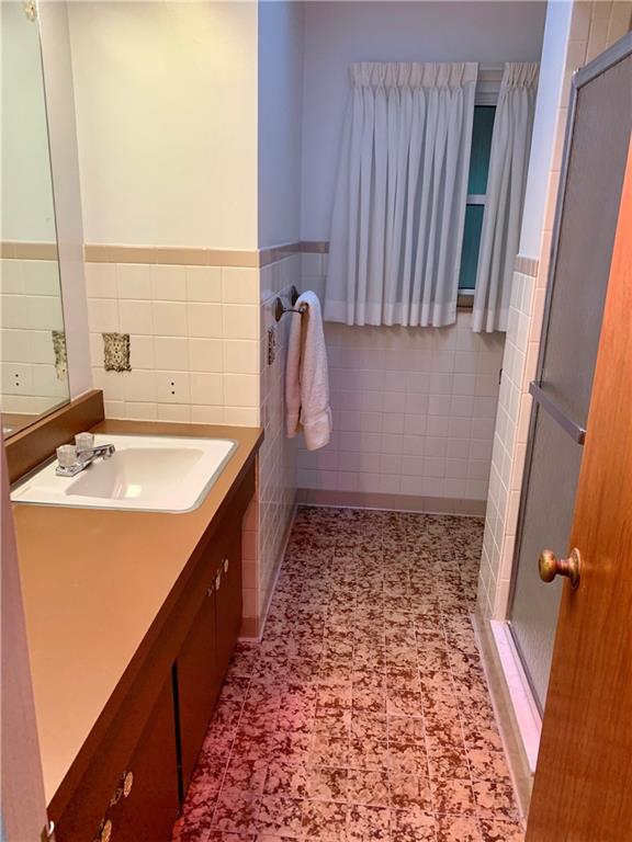 630 Broughton Road Bethel Park, PA 15102 - Photo 20 of 25 a bathroom with a sink and a mirror