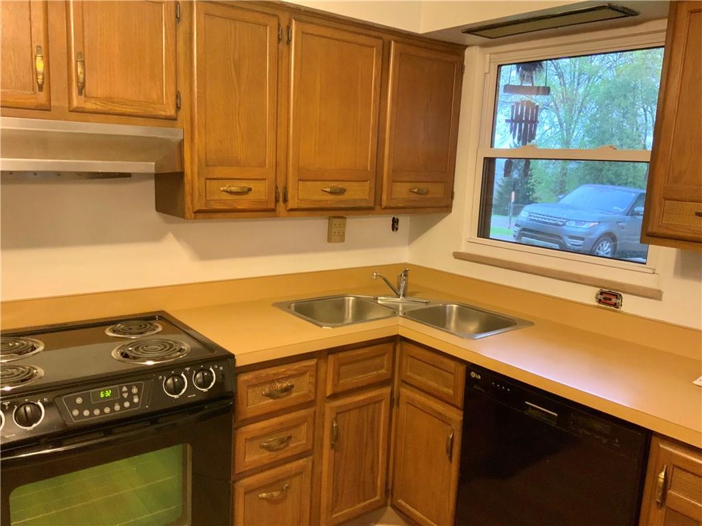 630 Broughton Road Bethel Park, PA 15102 - Photo 23 of 25 a kitchen with a sink and cabinets