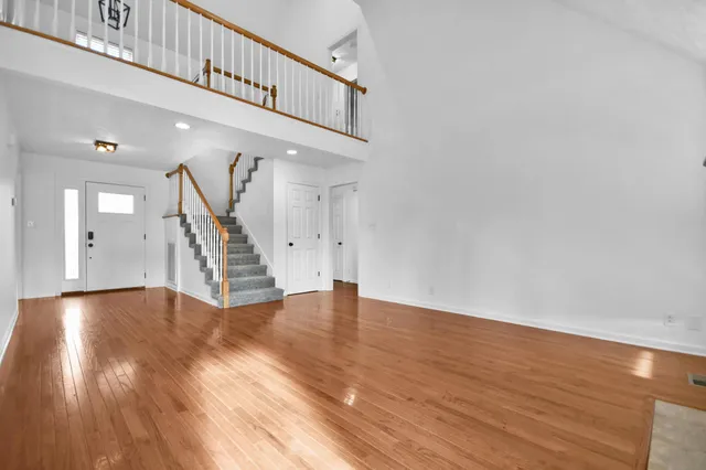 a view of an entryway with wooden floor