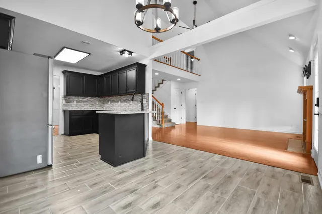 a view of kitchen with cabinets and wooden floor