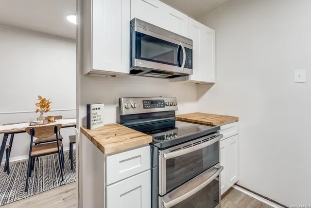 a kitchen with a stove and a microwave