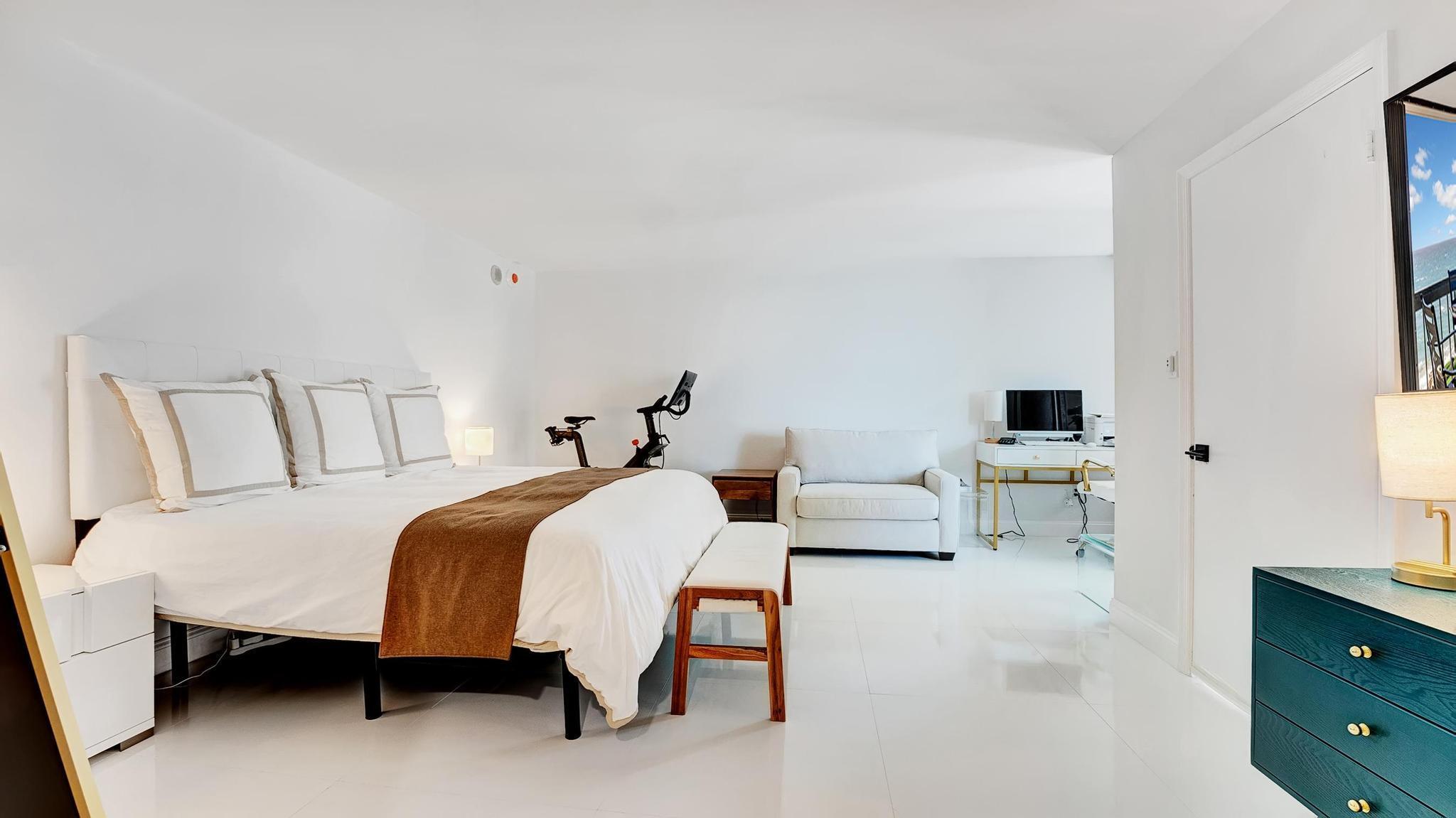 5380 North Ocean Drive, Unit 6C Riviera Beach, FL 33404 - Photo 12 of 33 a bedroom with bed and a couch