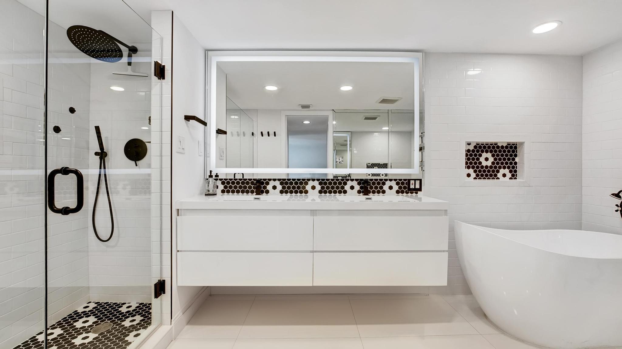 5380 North Ocean Drive, Unit 6C Riviera Beach, FL 33404 - Photo 14 of 33 a bathroom with a double vanity sink mirror and shower