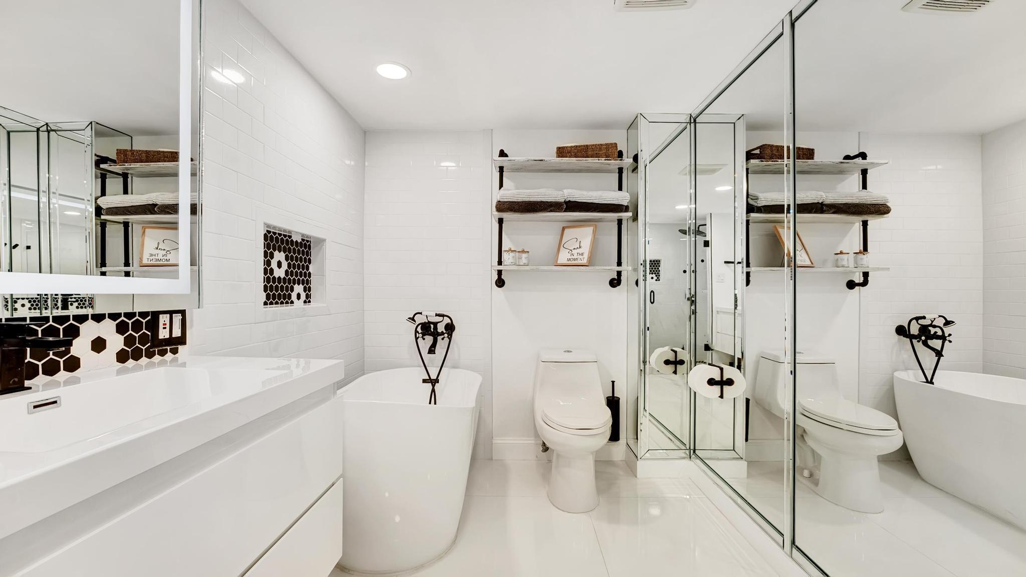 5380 North Ocean Drive, Unit 6C Riviera Beach, FL 33404 - Photo 15 of 33 a bathroom with a sink a toilet and shower