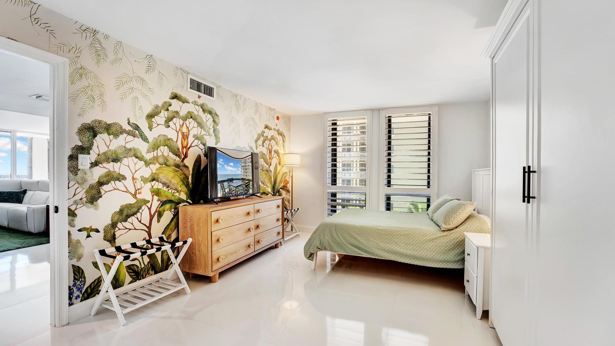5380 North Ocean Drive, Unit 6C Riviera Beach, FL 33404 - Photo 17 of 33 a bedroom with a bed and a window