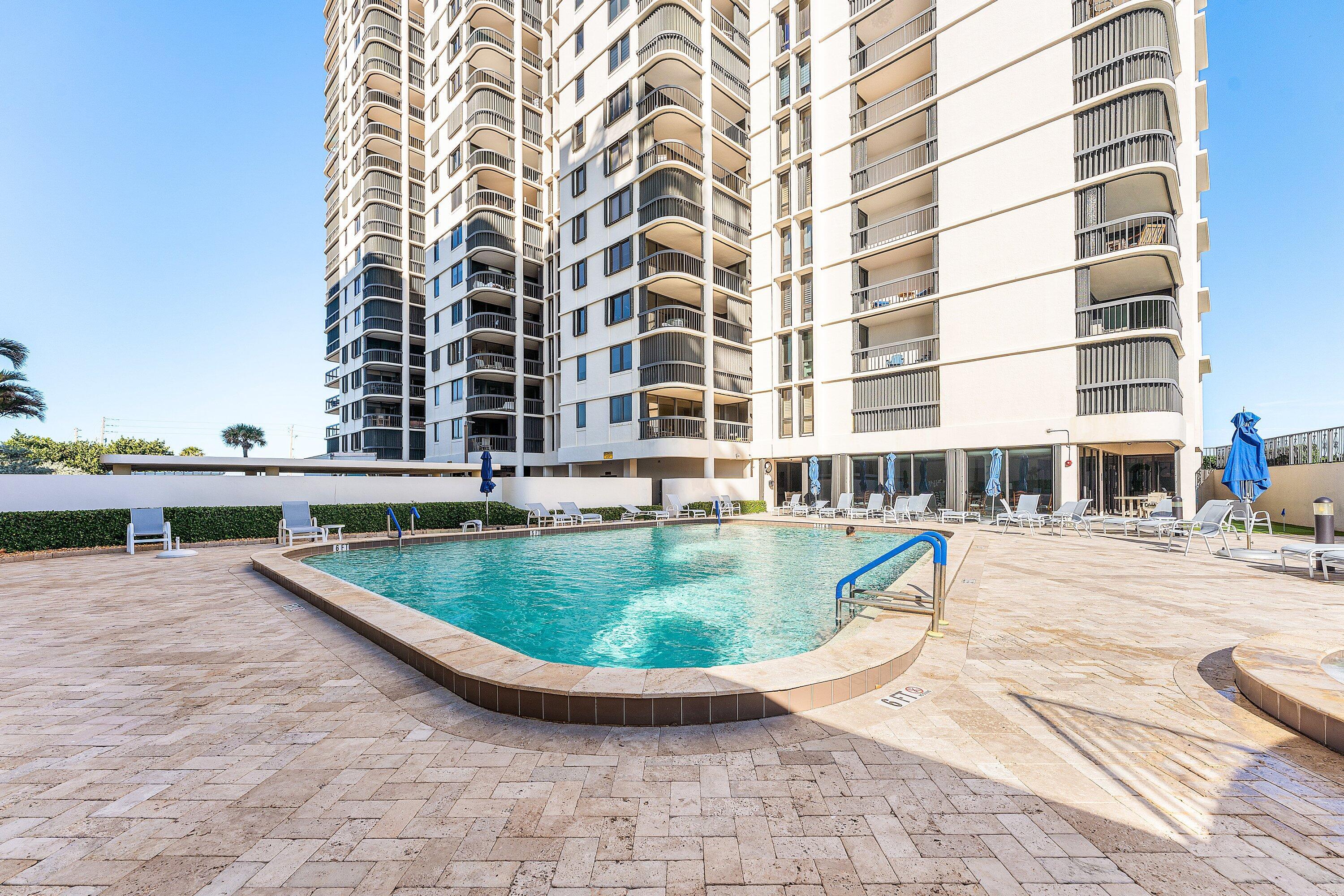 5380 North Ocean Drive, Unit 6C Riviera Beach, FL 33404 - Photo 24 of 33 swimming pool view with tall buildings
