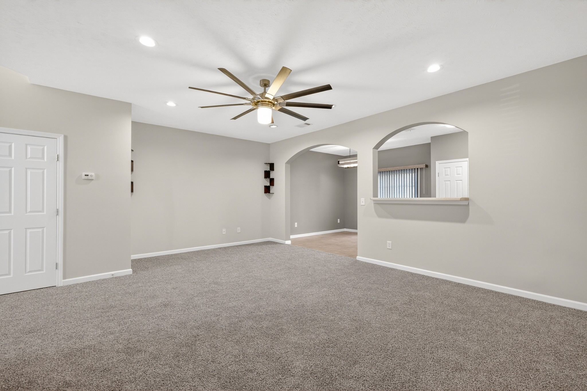 8333 Rossi Road Brentwood, TN 37027 - Photo 5 of 20 an empty room with chandelier fan and windows