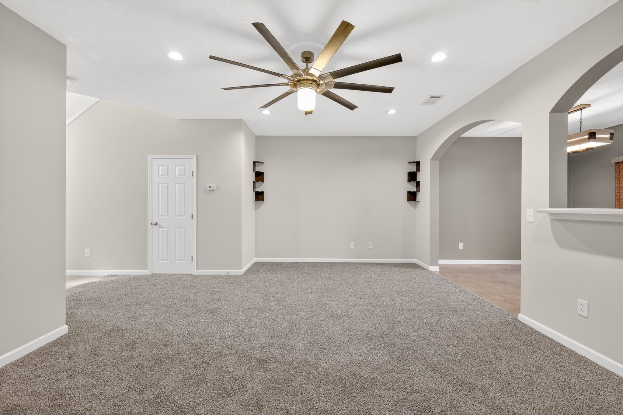 8333 Rossi Road Brentwood, TN 37027 - Photo 6 of 20 a view of an empty room with a ceiling fan