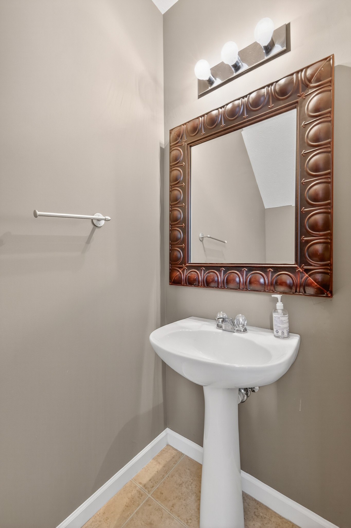 8333 Rossi Road Brentwood, TN 37027 - Photo 7 of 20 a bathroom with a sink a mirror and vanity