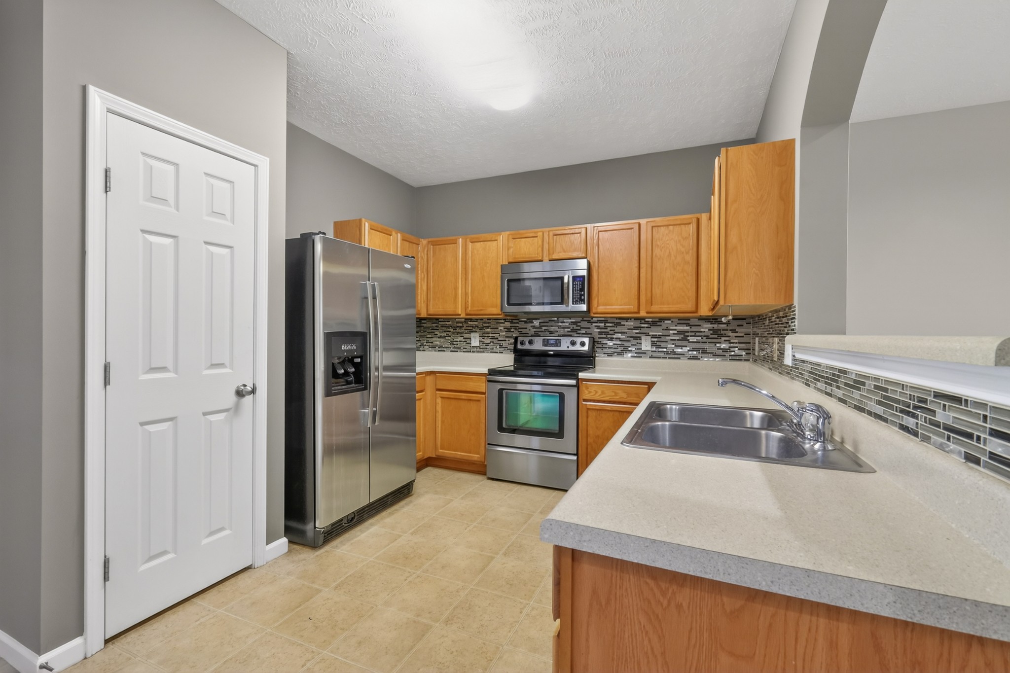 8333 Rossi Road Brentwood, TN 37027 - Photo 10 of 20 a kitchen with granite countertop a sink stainless steel appliances and cabinets