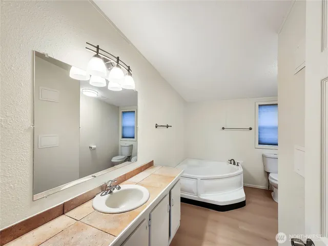 a bathroom with a sink double vanity and a mirror