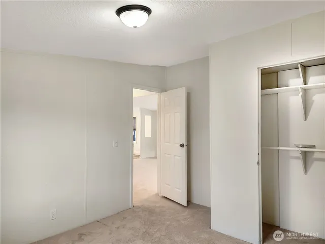 a bathroom with a sink toilet vanity and tub