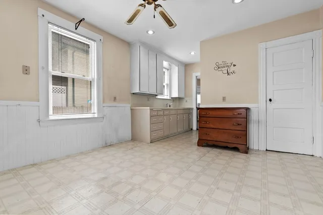 a room with window and cabinet