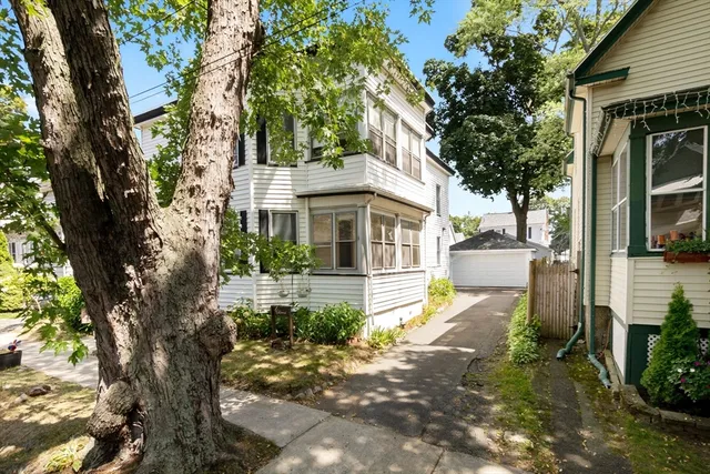 front view of a house with a yard