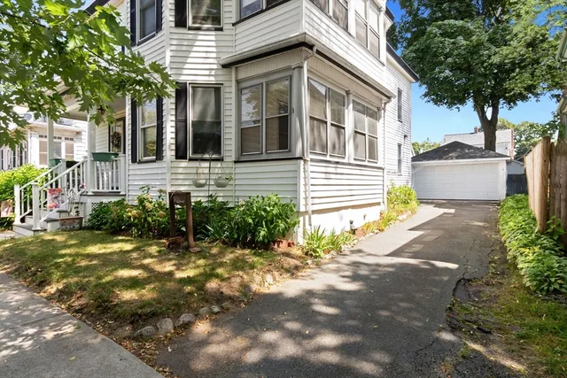 a view of a house with a yard