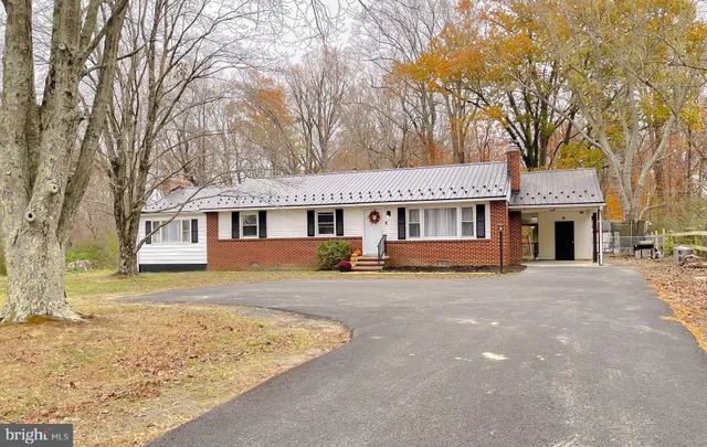front view of a house with a snow