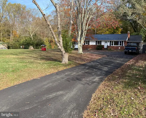 a view of house with outdoor space and street view