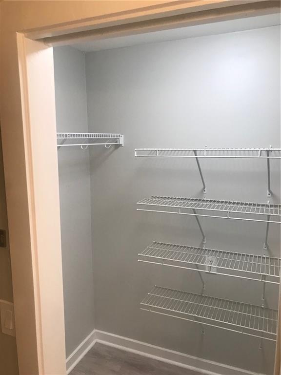 131 Fox Place Canton, GA 30114 - Photo 13 of 29 a view of a room with racks on the wall