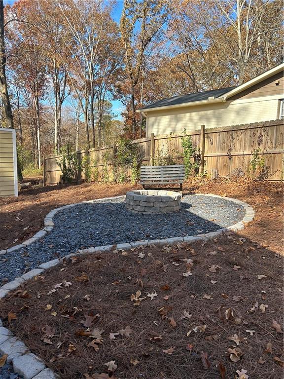 131 Fox Place Canton, GA 30114 - Photo 25 of 29 a view of a yard with a tree