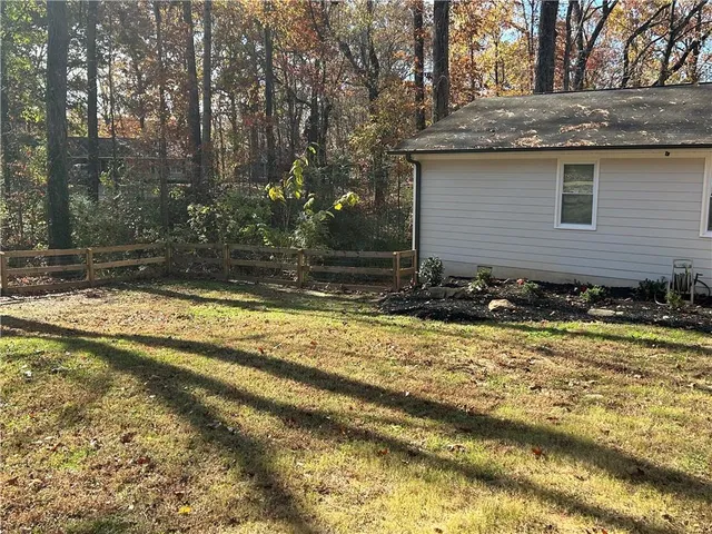 a view of a yard with trees