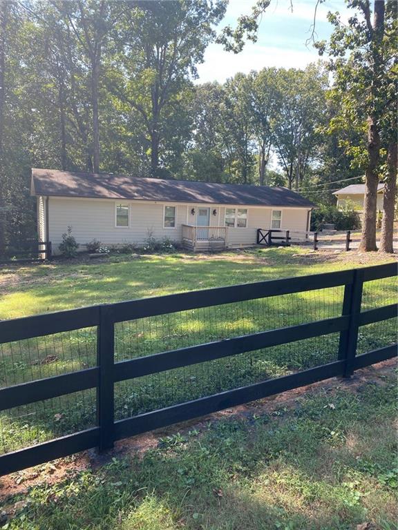 131 Fox Place Canton, GA 30114 - Photo 29 of 29 a view of a park with wooden fence and a bench