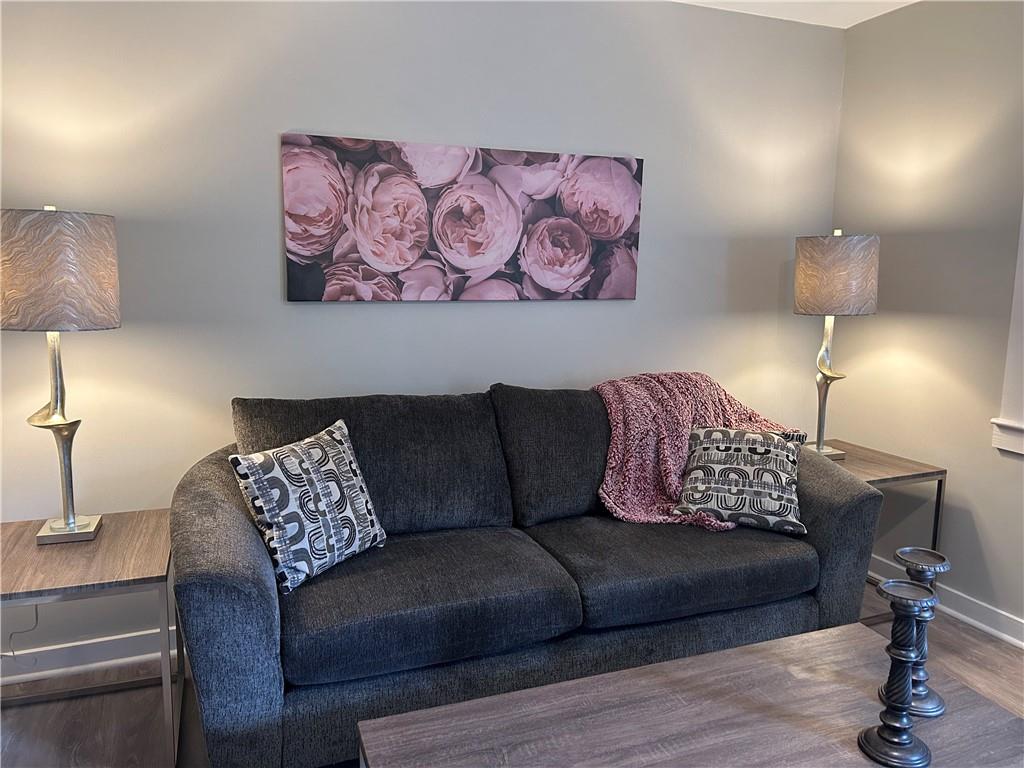 131 Fox Place Canton, GA 30114 - Photo 3 of 29 a living room with furniture and a lamp