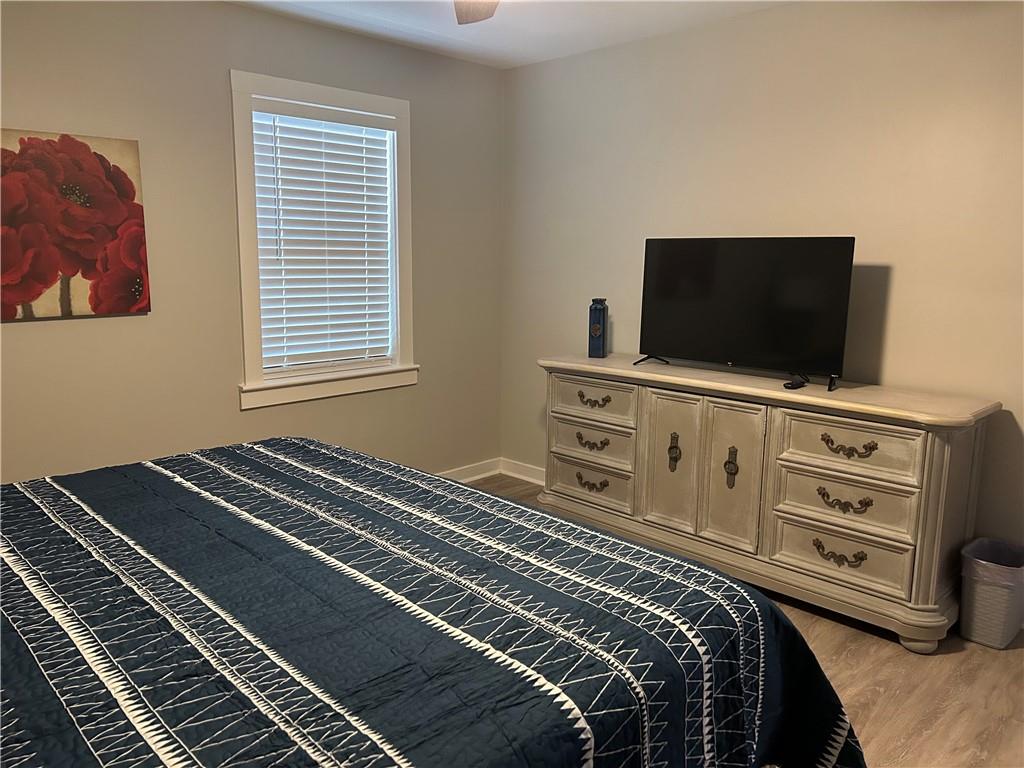 131 Fox Place Canton, GA 30114 - Photo 9 of 29 a bedroom with a bed and flat screen tv