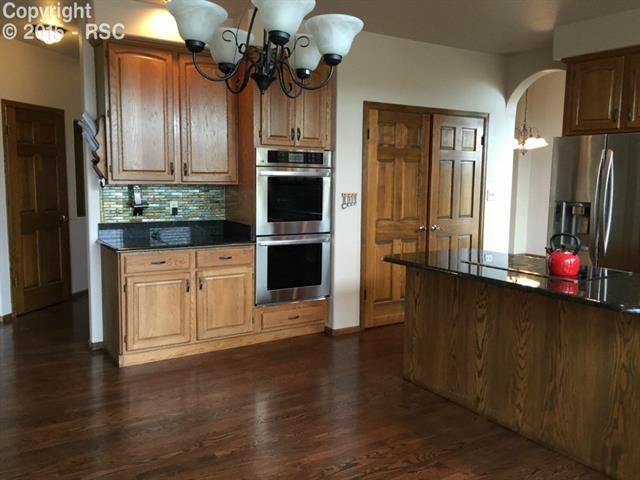 915 Forest View Road Monument, CO 80132 - Photo 5 of 35 new tile backsplash in kitchen