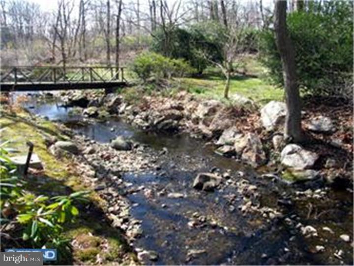 3574 Glenway Road Huntingdon Valley, PA 19006 - Photo 5 of 12 a view of a tree in a yard with a lake view