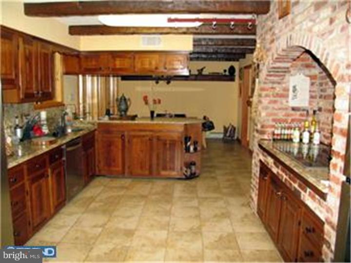 3574 Glenway Road Huntingdon Valley, PA 19006 - Photo 6 of 12 a kitchen with stainless steel appliances granite countertop a stove a sink and a microwave