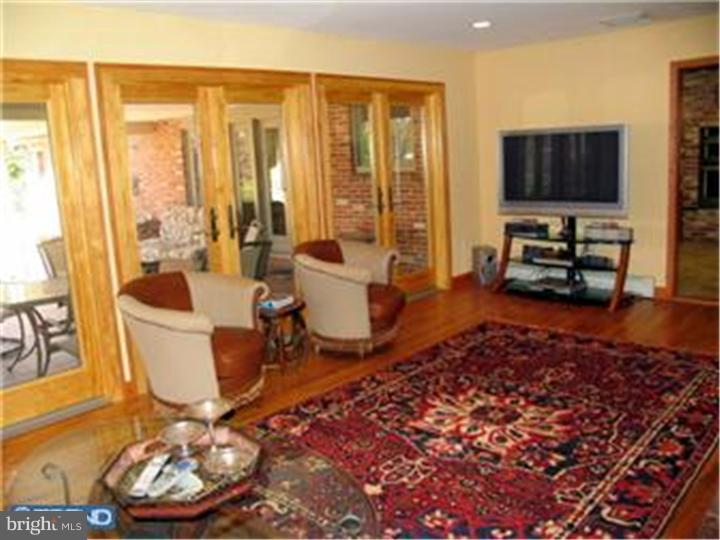 3574 Glenway Road Huntingdon Valley, PA 19006 - Photo 10 of 12 a living room with furniture and a flat screen tv