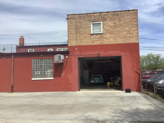 a view of a building with a lot of garage and a fireplace