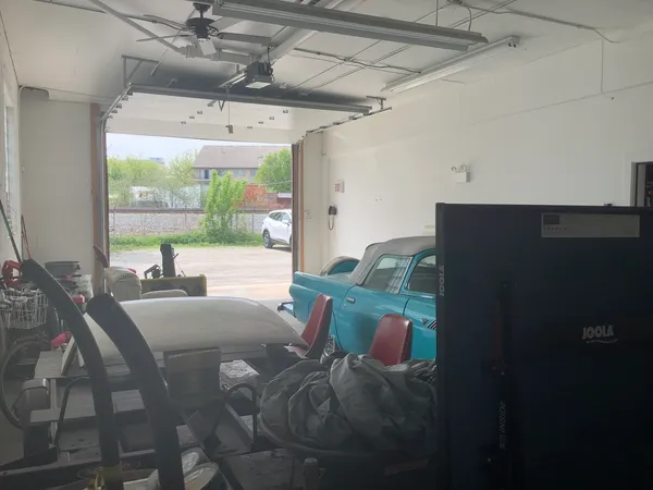 a view of street with parked cars