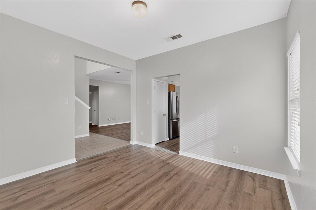 3401 Newgate Street Midlothian, TX 76065 - Photo 6 of 34 Interior space featuring wood-finish flooring, light gray wall paint, and white baseboards