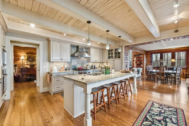 a view of a balcony with furniture and wooden floor