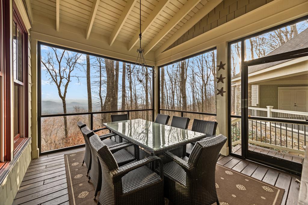 1115 Outlook Road Murphy, NC 28906 - Photo 22 of 60 a view of a balcony with furniture and wooden floor