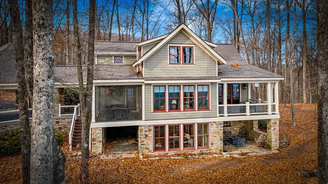 a bedroom with a bed couch and window