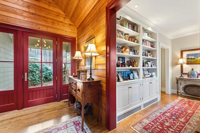 a bed room with a bed window and a chair