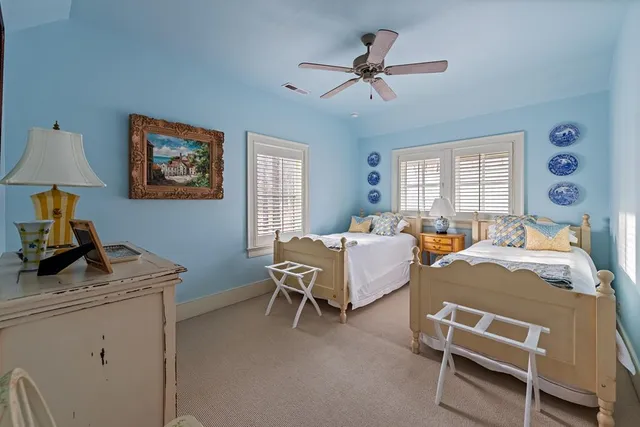 a hallway with furniture and wooden floor
