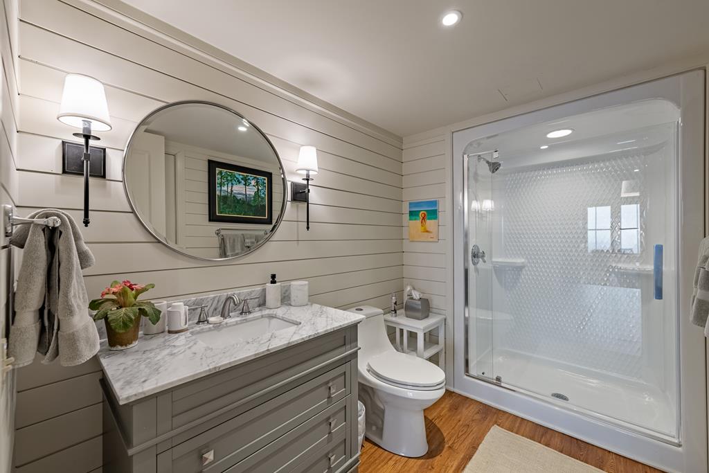 1115 Outlook Road Murphy, NC 28906 - Photo 43 of 60 a bathroom with a granite countertop toilet sink and mirror