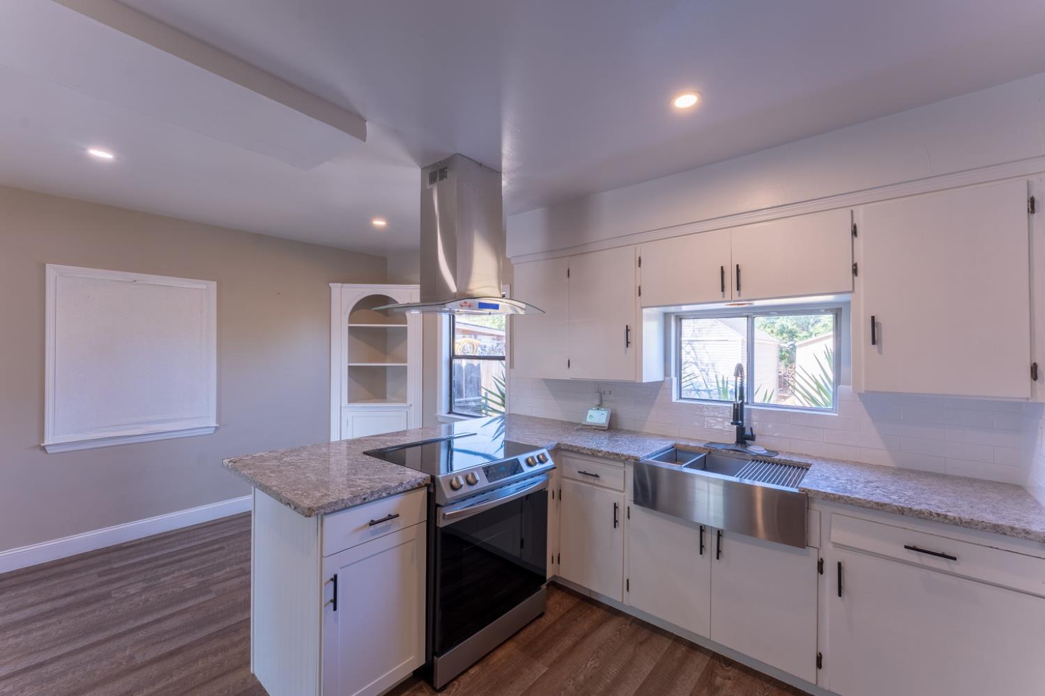 963 North Arthur Avenue Fresno, CA 93728 - Photo 14 of 26 a kitchen that has a sink a stove and window