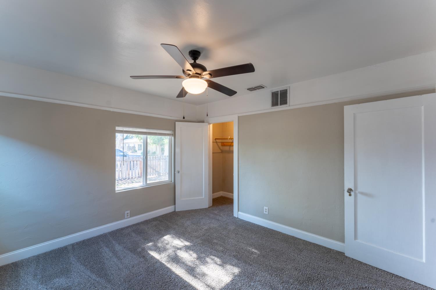 963 North Arthur Avenue Fresno, CA 93728 - Photo 19 of 26 a view of livingroom with window ceiling fan and hardwood floor