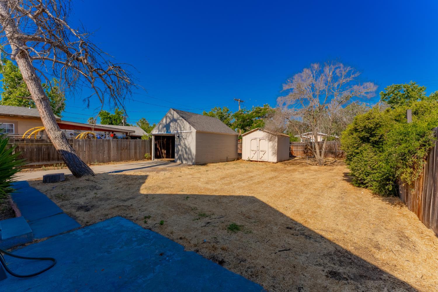 963 North Arthur Avenue Fresno, CA 93728 - Photo 23 of 26 a view of a house with a yard