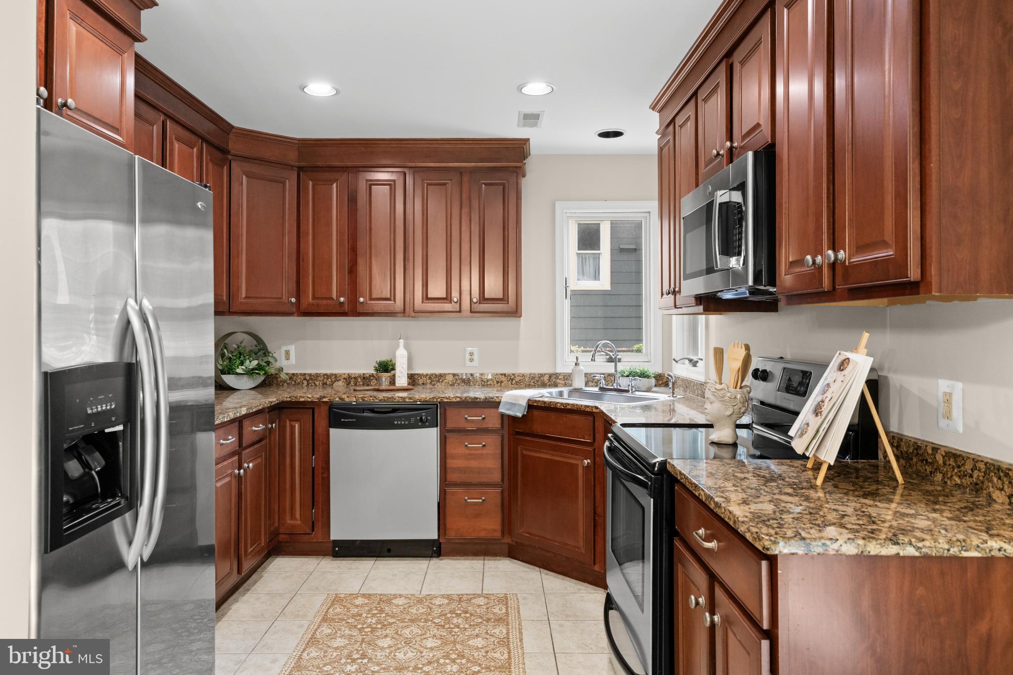 310 South Washington Avenue Moorestown, NJ 08057 - Photo 12 of 37 a kitchen with stainless steel appliances granite countertop a stove a sink dishwasher and a refrigerator