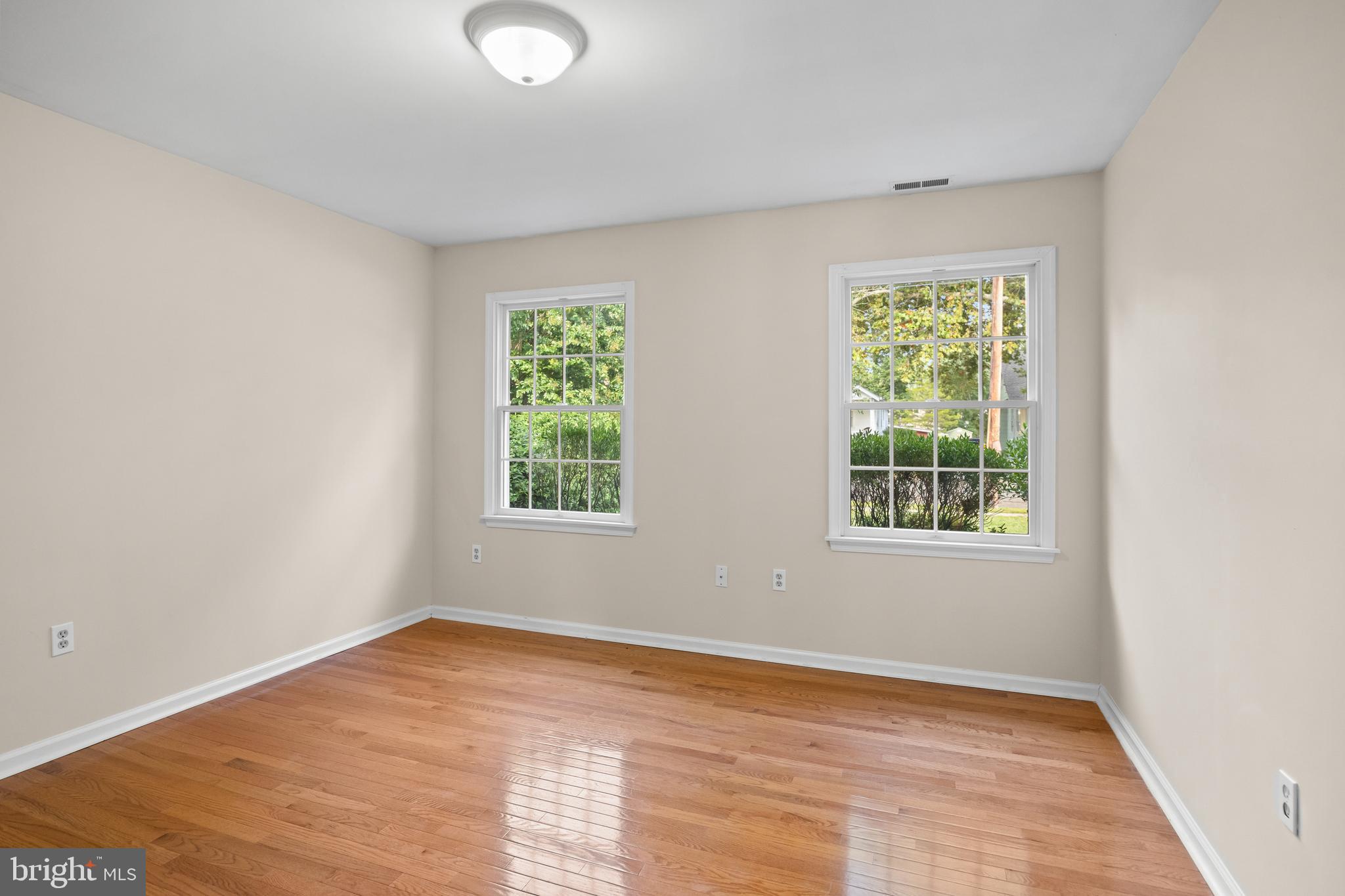310 South Washington Avenue Moorestown, NJ 08057 - Photo 19 of 37 an empty room with wooden floor and windows